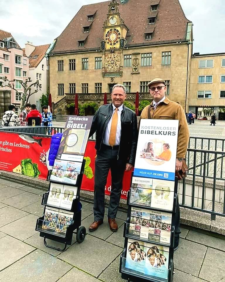 Bible course display in an urban public square.